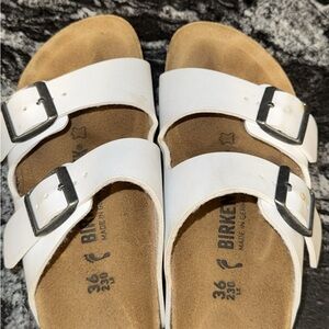 Birkenstock White Sandals with Black Buckles